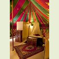 View of the sleeping area and bathroomwall of our luxurious rental tent La Jaima