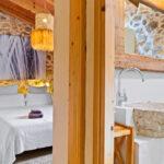 Peek-through from the hallway to the bathroom and bedroom at cottage holiday spain